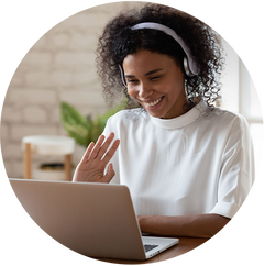 woman on laptop waving