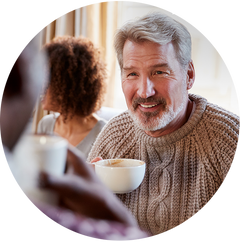 man holding cup van coffee