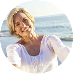 Woman at beach smiling